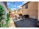 Backyard with a patio seating area with a grill and string lights at 3367 Popcorn Flower St, Las Vegas, NV 89117