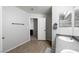 Bathroom featuring wood-look flooring, large mirror, and a stylish gray countertop at 3367 Popcorn Flower St, Las Vegas, NV 89117