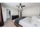 Bedroom featuring carpet, a modern ceiling fan, walk-in closet and a gray color scheme at 3367 Popcorn Flower St, Las Vegas, NV 89117