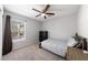 Bedroom featuring carpet, modern ceiling fan, and bright natural light at 3367 Popcorn Flower St, Las Vegas, NV 89117