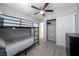 Bedroom features a bunk bed, ceiling fan, and carpeted flooring with closet at 3367 Popcorn Flower St, Las Vegas, NV 89117