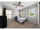 Bedroom featuring carpet, two large windows and a ceiling fan at 3367 Popcorn Flower St, Las Vegas, NV 89117