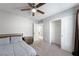 Bedroom with ceiling fan and carpet, providing a comfortable living space at 3367 Popcorn Flower St, Las Vegas, NV 89117
