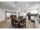 Bright dining area adjacent to the kitchen, stainless appliances and living room at 3367 Popcorn Flower St, Las Vegas, NV 89117