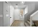 Bright entryway with neutral walls, light vinyl flooring, and a staircase leading to the upper level at 3367 Popcorn Flower St, Las Vegas, NV 89117