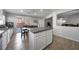 Modern kitchen and dining area with stainless steel appliances, an island, and access to the patio at 3367 Popcorn Flower St, Las Vegas, NV 89117