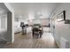 Bright kitchen with stainless steel appliances, center island and a dining area with sliding doors to backyard at 3367 Popcorn Flower St, Las Vegas, NV 89117