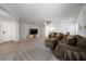 Spacious living room with neutral carpet, a ceiling fan, and comfortable seating at 3367 Popcorn Flower St, Las Vegas, NV 89117