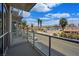 Spacious balcony overlooking palm trees, city streets, and neighborhood buildings at 353 E Bonneville Ave # 215, Las Vegas, NV 89101