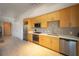 A bright modern kitchen with natural wood cabinets and stainless steel appliances at 353 E Bonneville Ave # 215, Las Vegas, NV 89101
