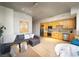 Open-concept living room featuring modern decor, a cozy sofa, and a well-equipped kitchen at 353 E Bonneville Ave # 215, Las Vegas, NV 89101