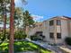Exterior view of condo complex with desert landscaping, sidewalks and mature trees at 3750 Desert Marina Dr # 37, Laughlin, NV 89029