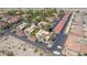 Aerial view of a residential complex with mature trees, red tile roofs, and plenty of parking at 3791 Desert Marina Dr # 109, Laughlin, NV 89029