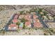 This aerial view captures the complex featuring uniform buildings, ample parking, and community pool surrounded by desert landscape at 3791 Desert Marina Dr # 109, Laughlin, NV 89029