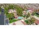 An aerial shot of a charming residential community featuring a pool, mature trees, and well-maintained landscaping at 3791 Desert Marina Dr # 109, Laughlin, NV 89029