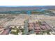 Extensive aerial view showcases a community with river views and a mix of residential and natural landscapes at 3791 Desert Marina Dr # 109, Laughlin, NV 89029