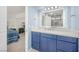 Bathroom with marble counters, a large vanity with a lighted mirror, and access to the bedroom at 3791 Desert Marina Dr # 109, Laughlin, NV 89029