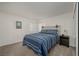 Cozy bedroom featuring a queen sized bed, carpet, and nightstand at 3791 Desert Marina Dr # 109, Laughlin, NV 89029