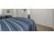 Bedroom featuring carpeted floors, a mirror, and access to the bathroom with a blue vanity at 3791 Desert Marina Dr # 109, Laughlin, NV 89029