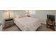 Bedroom featuring neutral colors, carpeted floors, and wooden bedside tables with lamps at 3791 Desert Marina Dr # 109, Laughlin, NV 89029