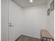 Clean entryway with white door, bench, and neutral carpet at 3791 Desert Marina Dr # 109, Laughlin, NV 89029
