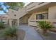 Condo building exterior featuring desert landscaping and stucco facade at 3791 Desert Marina Dr # 109, Laughlin, NV 89029