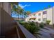 Exterior of a two-story apartment complex featuring stucco siding and staircase at 3791 Desert Marina Dr # 109, Laughlin, NV 89029