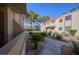 Manicured exterior of condo complex with mature trees and desert landscaping at 3791 Desert Marina Dr # 109, Laughlin, NV 89029