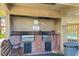 Community grill area features brick surround, prep area and is covered for shade at 3791 Desert Marina Dr # 109, Laughlin, NV 89029