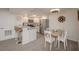 A view of the condo kitchen and dining area, featuring neutral color palette at 3791 Desert Marina Dr # 109, Laughlin, NV 89029