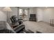 Living room featuring leather recliners, TV, and access to private patio at 3791 Desert Marina Dr # 109, Laughlin, NV 89029