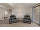 Cozy living room featuring leather chairs, lamp, and view to patio at 3791 Desert Marina Dr # 109, Laughlin, NV 89029