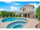 Home featuring a pool, spa, and covered patio in the backyard at 3846 Biltmore Bay St, Las Vegas, NV 89147