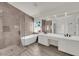 Modern bathroom with a large soaking tub, walk-in shower, and dual vanity sinks at 3846 Biltmore Bay St, Las Vegas, NV 89147