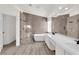 Spacious bathroom with dual vanities, soaking tub, and separate walk-in shower for a spa-like retreat at 3846 Biltmore Bay St, Las Vegas, NV 89147