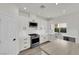 Modern kitchen featuring white cabinets, stainless steel appliances and a view to the outdoor space at 3846 Biltmore Bay St, Las Vegas, NV 89147