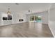 Spacious living room with hardwood floors, fireplace and sliding glass doors to the pool at 3846 Biltmore Bay St, Las Vegas, NV 89147