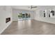 Living room with hardwood floors, modern fireplace, and access to a private swimming pool at 3846 Biltmore Bay St, Las Vegas, NV 89147