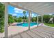 Backyard view of a sparkling swimming pool with a spa and covered patio at 3846 Biltmore Bay St, Las Vegas, NV 89147