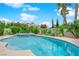 Clear blue swimming pool with spa and well-maintained landscaping at 3846 Biltmore Bay St, Las Vegas, NV 89147