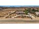 Aerial view of the home featuring mature landscaping, a circular driveway, and mountain views at 4075 W Torino Ave, Las Vegas, NV 89139
