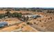 This aerial view captures a desert property, complete with equestrian facilities and mature shade trees at 4075 W Torino Ave, Las Vegas, NV 89139