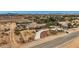 This desert property features a spacious, gated yard, a home with a tile roof, and mature landscaping at 4075 W Torino Ave, Las Vegas, NV 89139