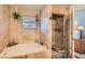 Luxurious bathroom featuring a soaking tub and separate shower for ultimate relaxation at 4075 W Torino Ave, Las Vegas, NV 89139