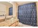 Elegant bathroom with a vessel sink, granite countertop, and modern shower at 4075 W Torino Ave, Las Vegas, NV 89139