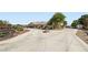 Long concrete driveway leads to this charming home, with a split section and mature trees surrounding at 4075 W Torino Ave, Las Vegas, NV 89139