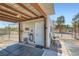 Outdoor building with awning, and a white door to welcome you in and begin your equestrian adventures at 4075 W Torino Ave, Las Vegas, NV 89139