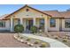 Inviting front entrance with decorative cacti and rock landscaping at 4075 W Torino Ave, Las Vegas, NV 89139
