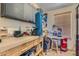Organized garage space with ample storage solutions and a functional workbench at 4075 W Torino Ave, Las Vegas, NV 89139