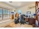 Functional home office with a large window, built-in storage, and plenty of workspace at 4075 W Torino Ave, Las Vegas, NV 89139